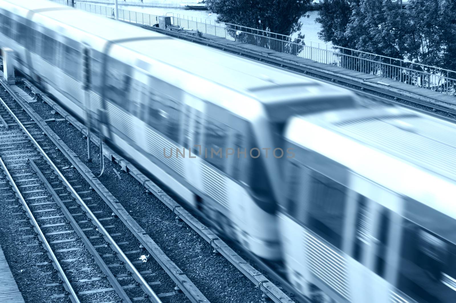 Transportation conceptual image. A speeding train on rails in Stockholm.