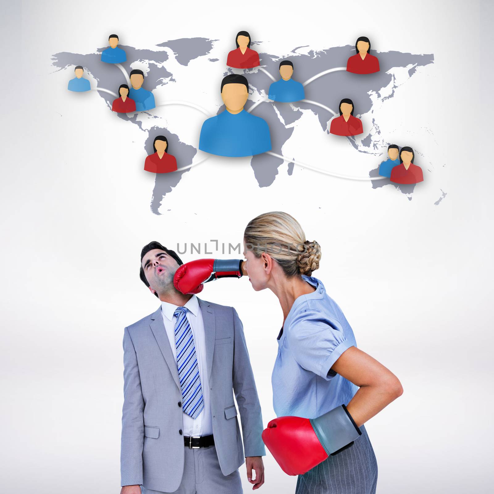 Composite image of businesswoman punching colleague with boxing gloves by Wavebreakmedia