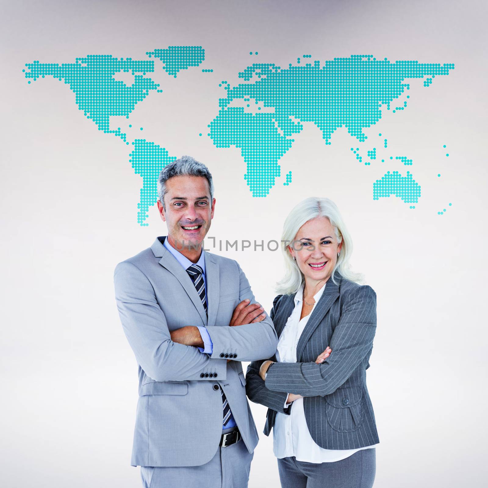 Smiling businesswoman and man with arms crossed against green world map on white background