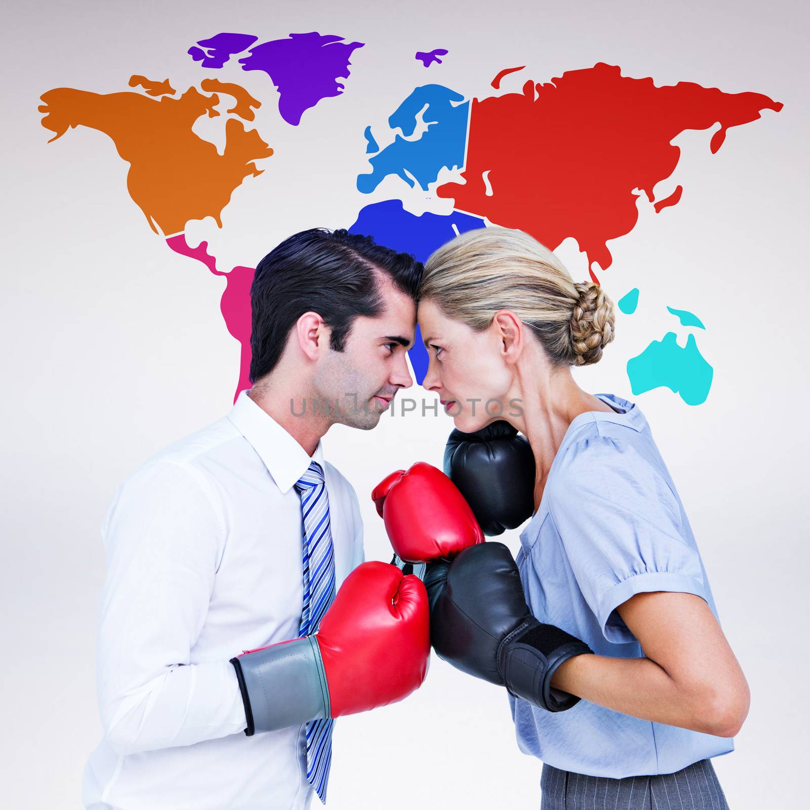 Business people wearing and boxing red gloves against grey background