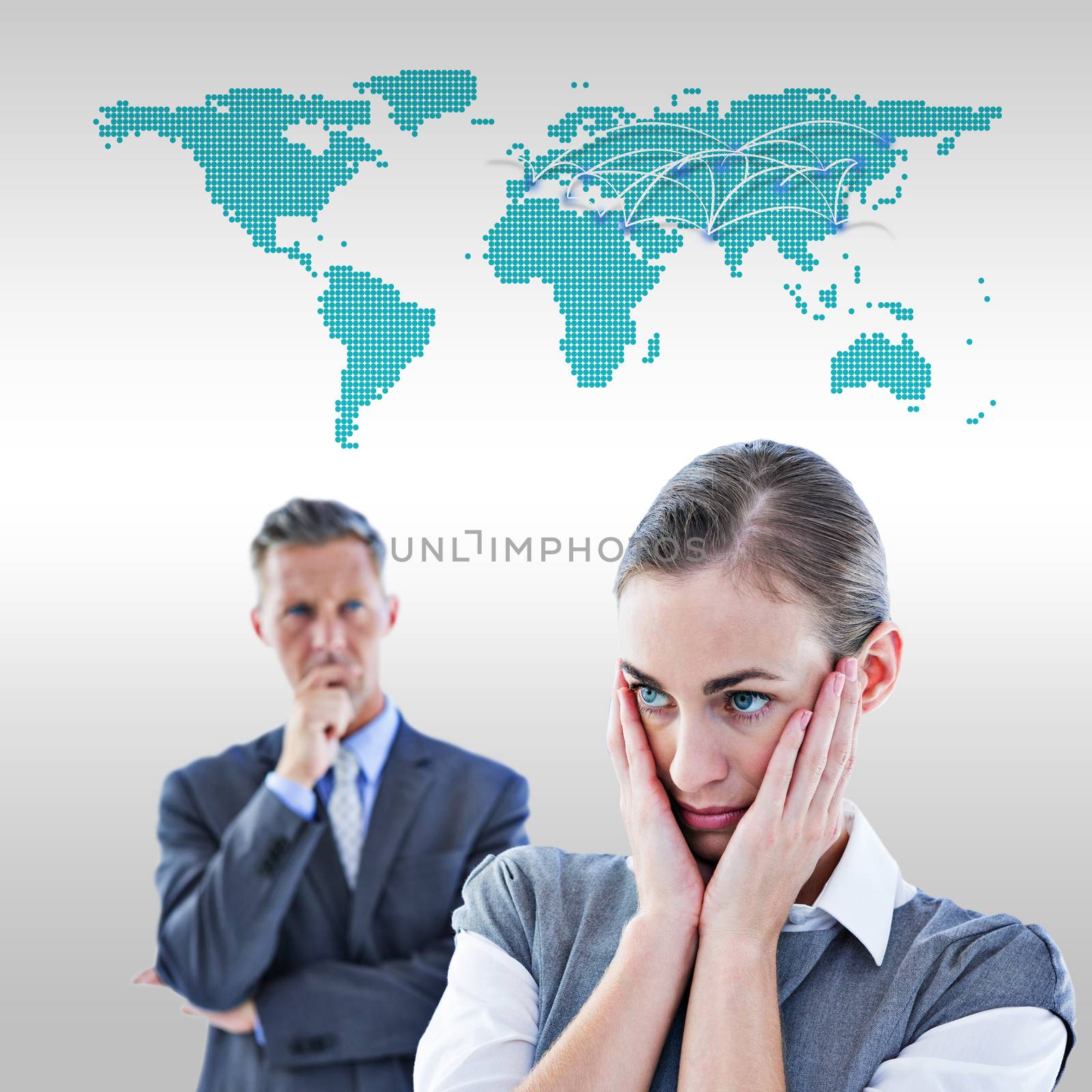 Business team thinking against world map 