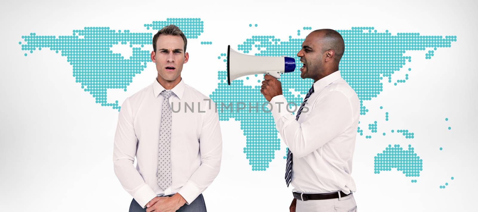 Businessman yelling with a megaphone at his colleague against green world map on white background