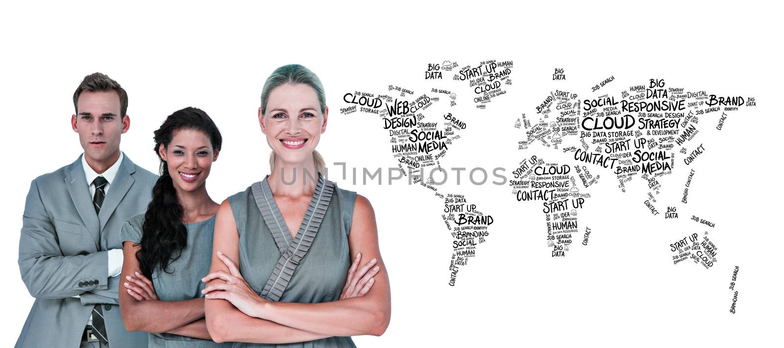 Happy business team smiling at camera  against world map of buzzwords