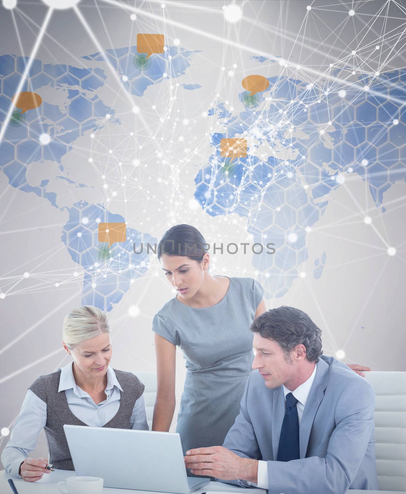 Business people using laptop against world map 