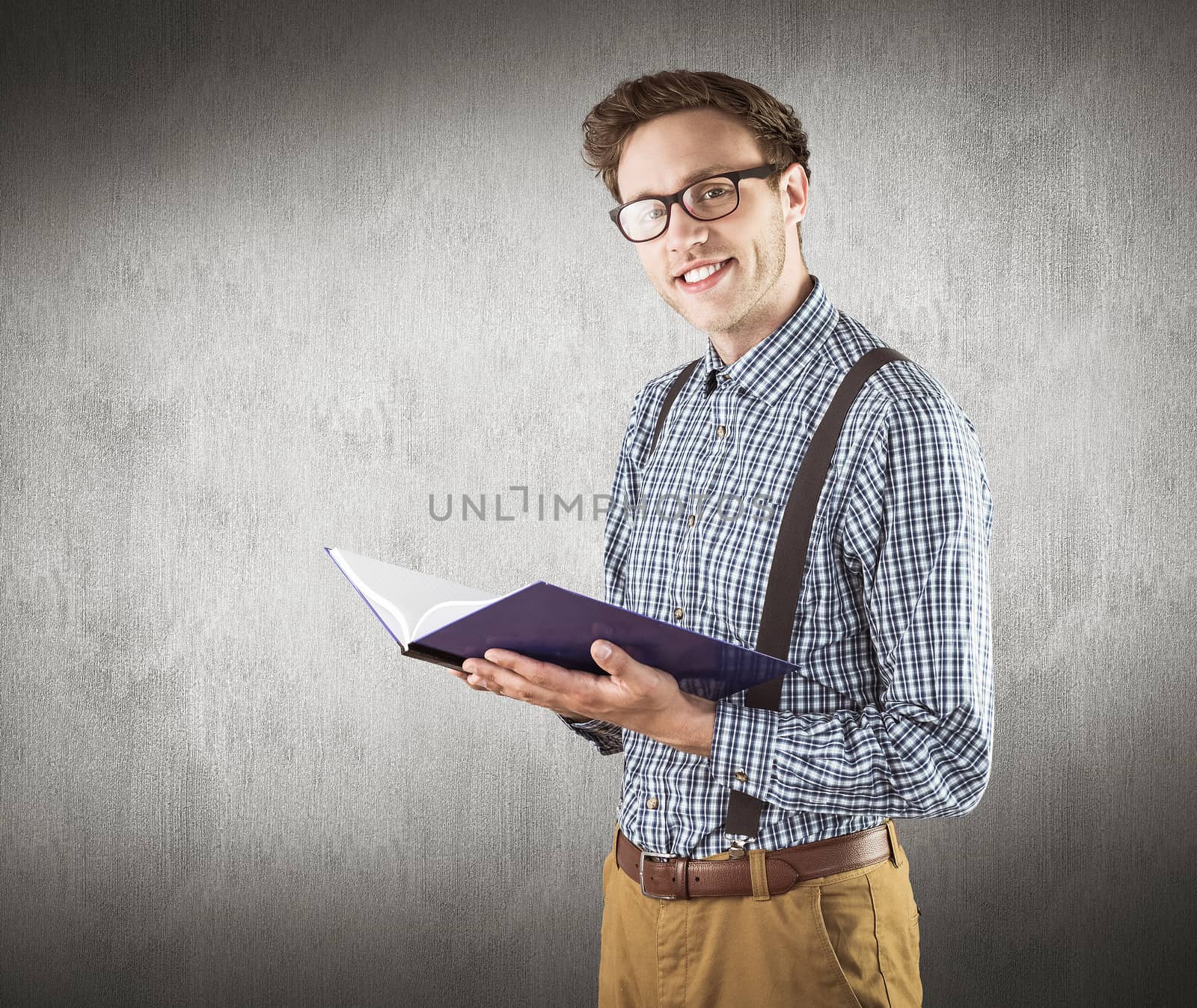 Composite image of geeky student reading a book by Wavebreakmedia