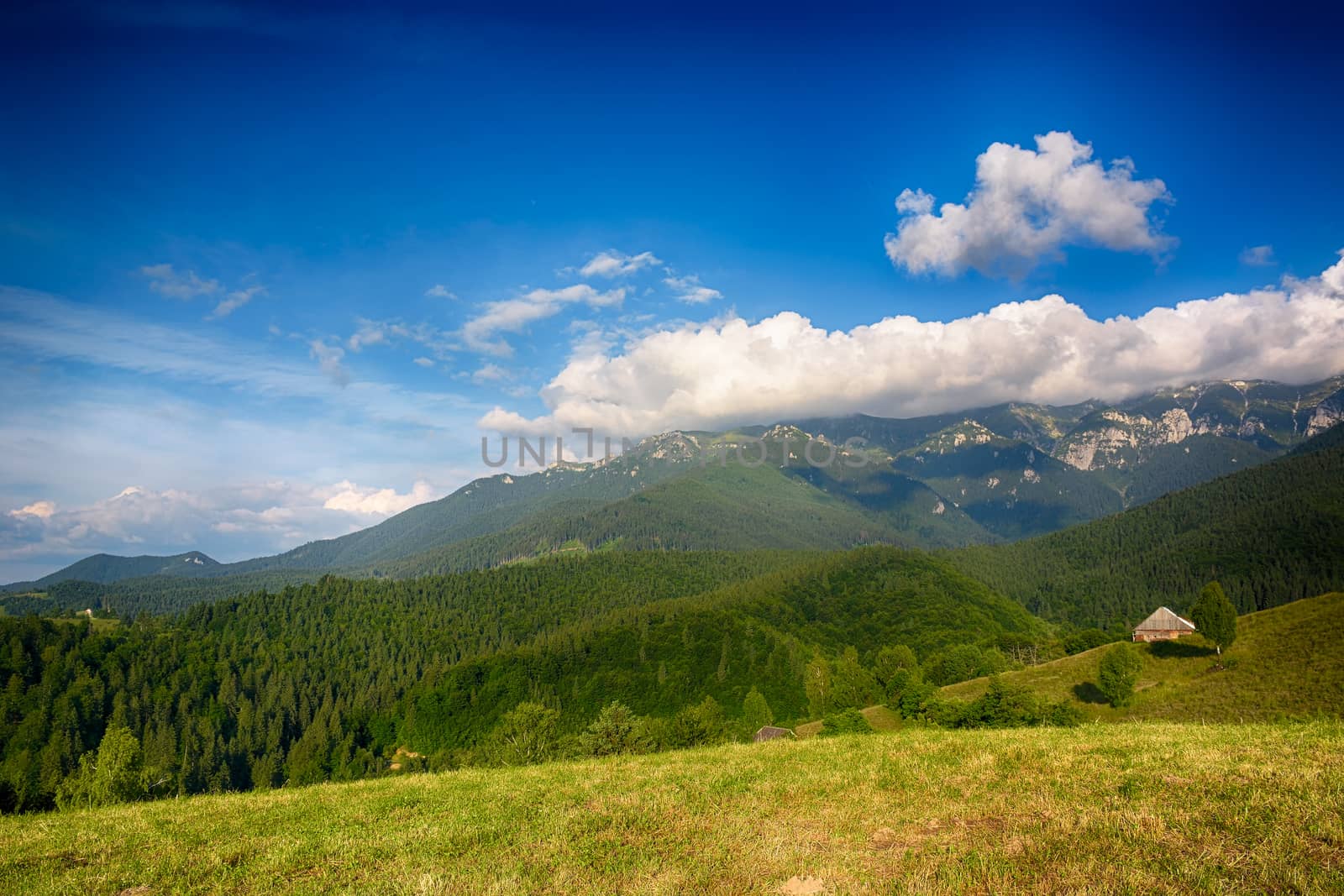 Evening, sunset on mountain hills of Simon village. Bran. by constantinhurghea