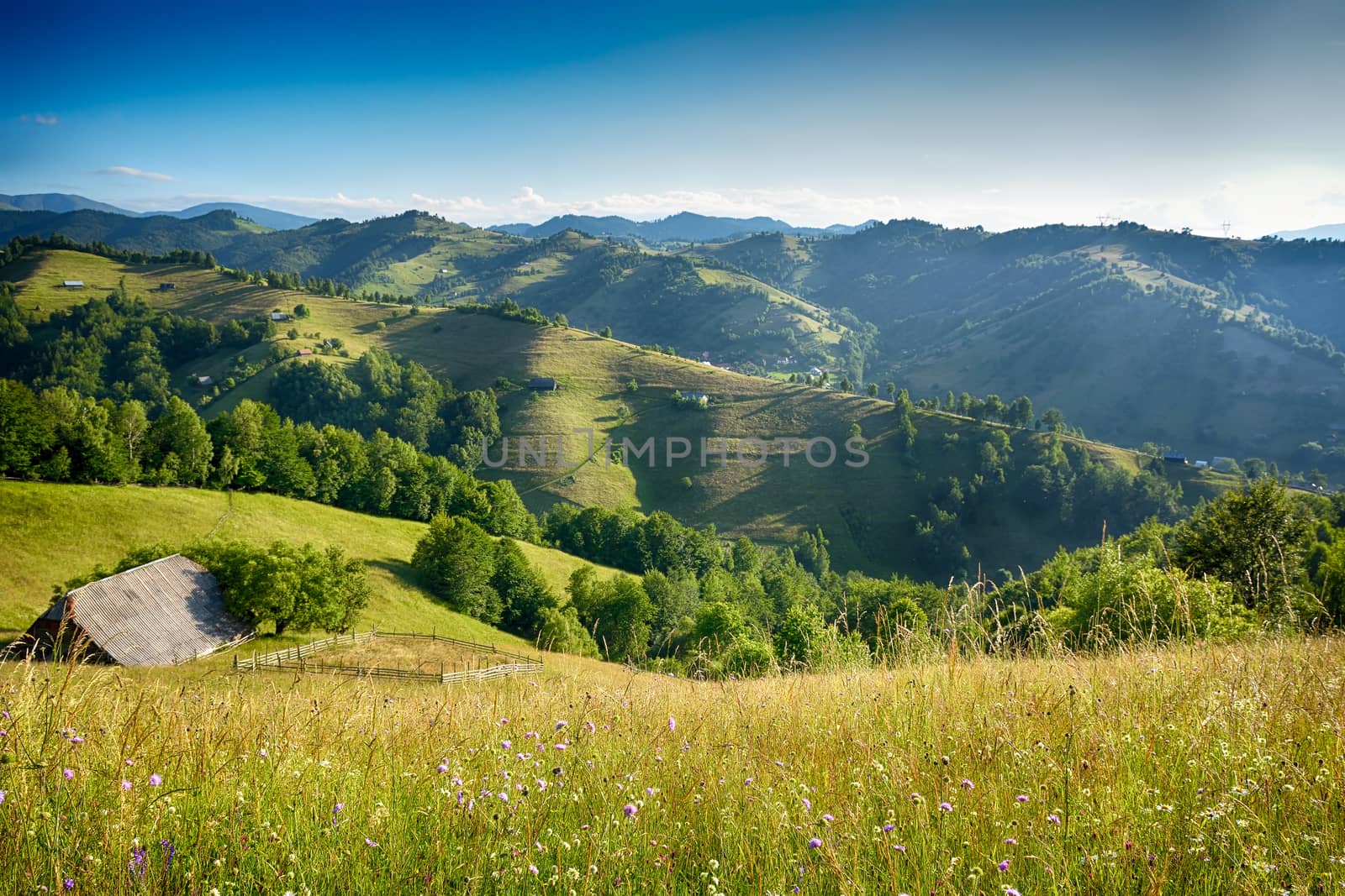 Evening, sunset on mountain hills of Simon village. Bran.