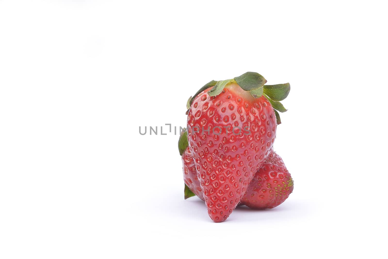 fresh raw strawberries  over white background by constantinhurghea
