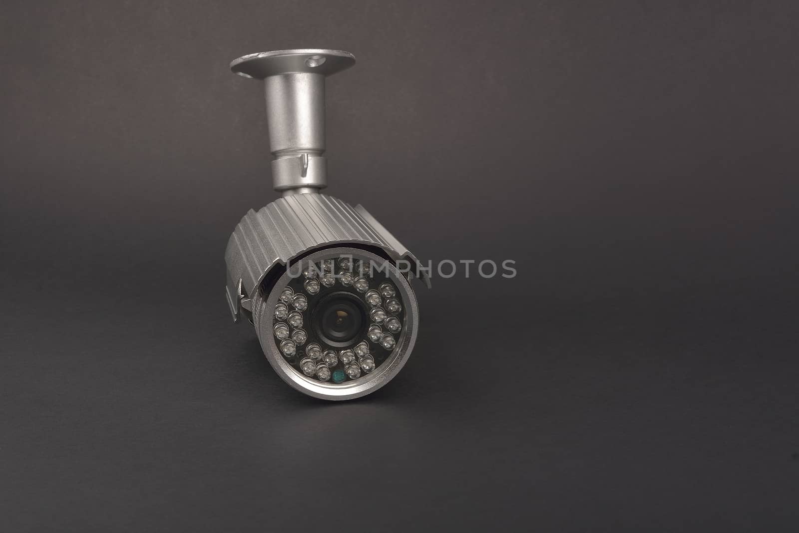 security camera on dark background by constantinhurghea