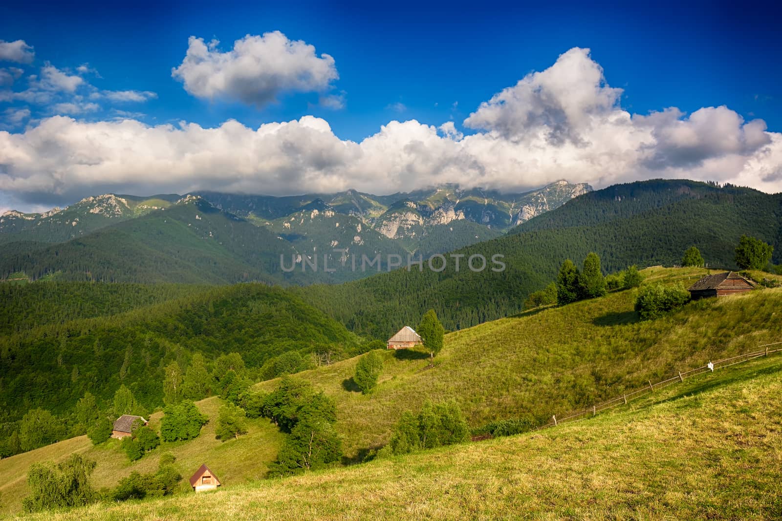 Evening, sunset on mountain hills of Simon village. Bran. by constantinhurghea