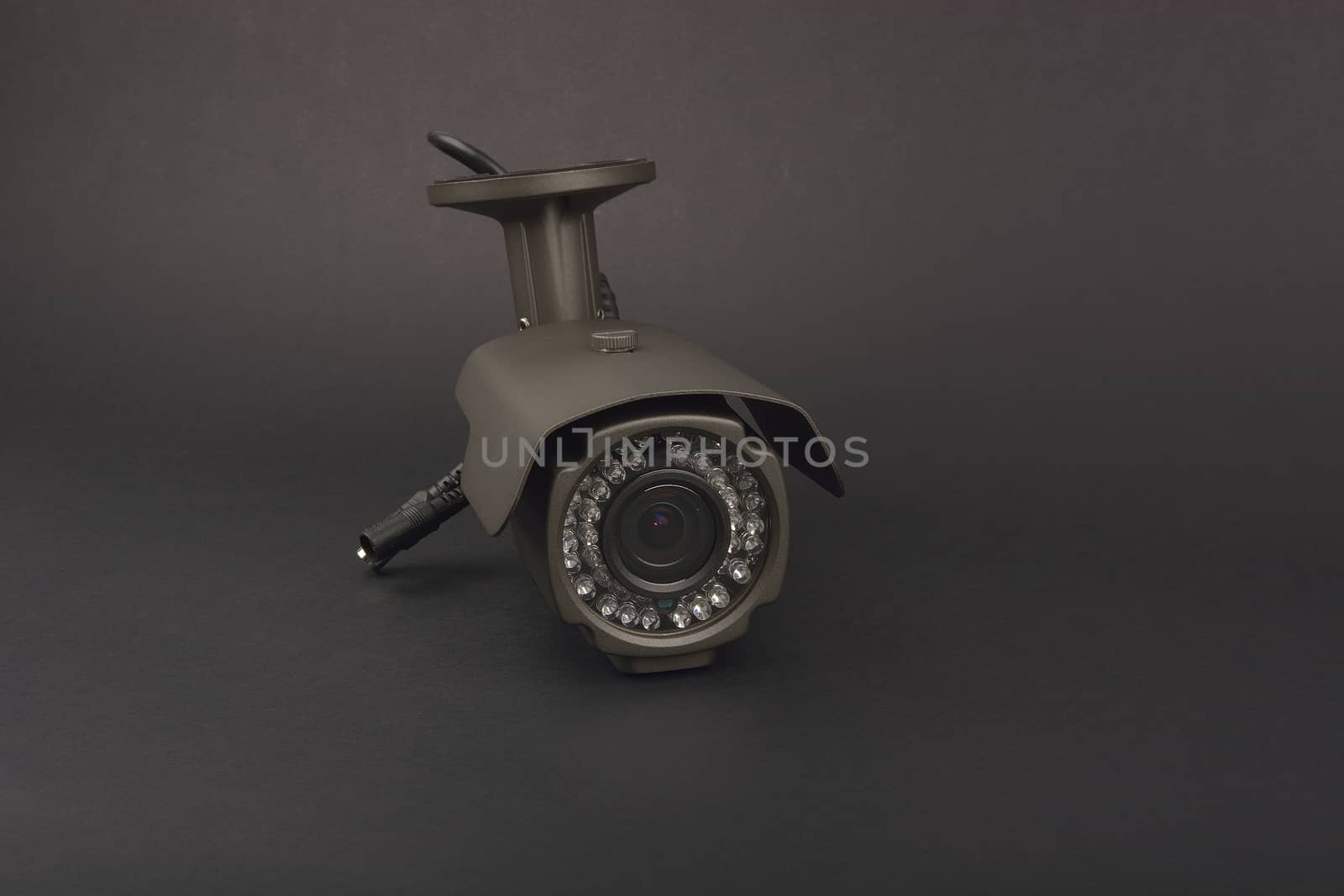 security camera on dark background by constantinhurghea