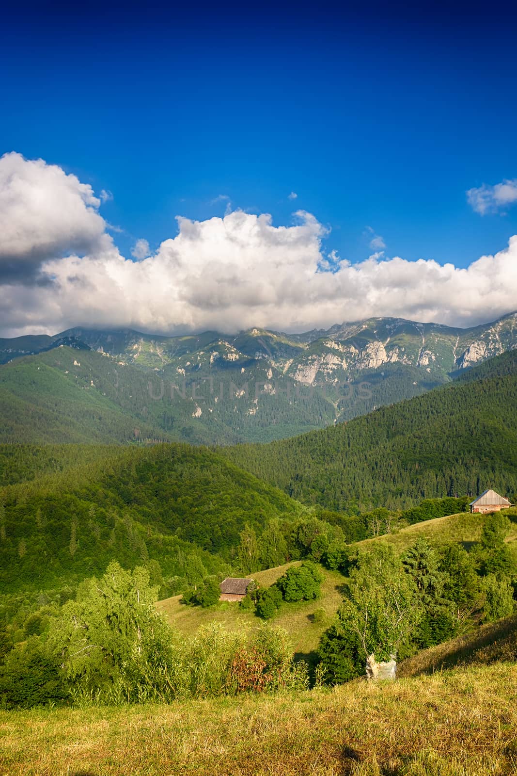 Evening, sunset on mountain hills of Simon village. Bran. by constantinhurghea