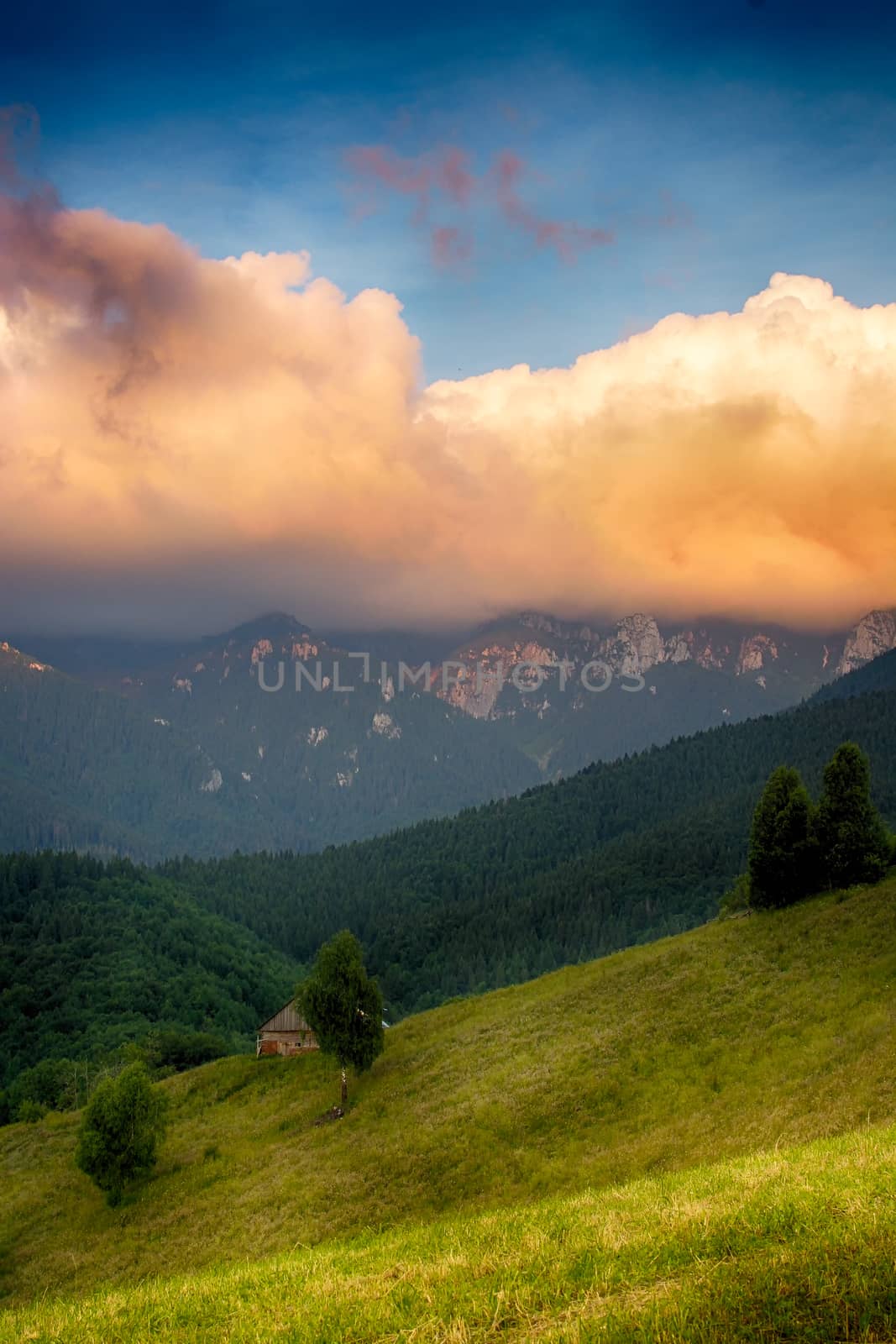 Evening, sunset on mountain hills of Simon village. Bran. by constantinhurghea