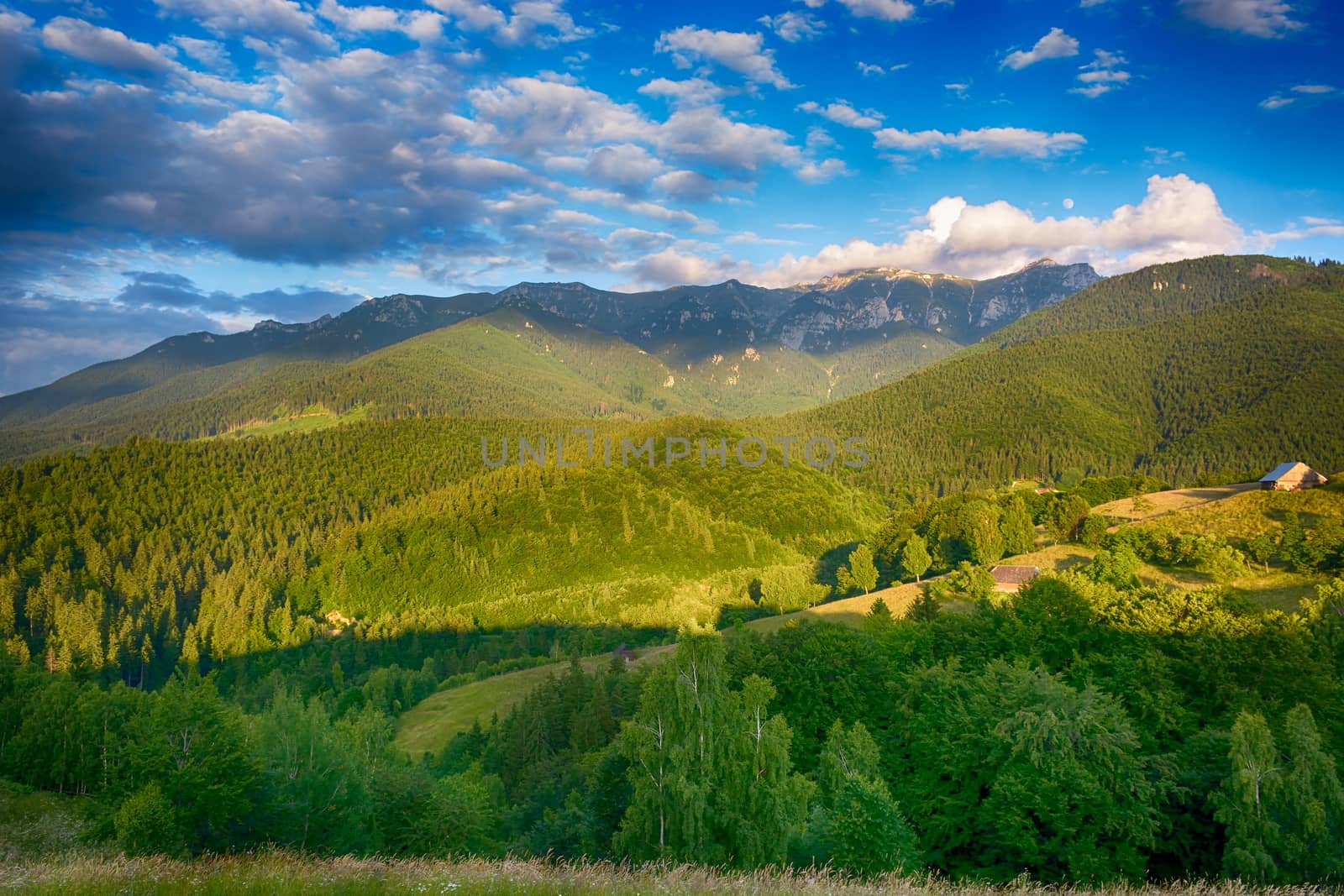 Evening, sunset on mountain hills of Simon village. Bran. by constantinhurghea