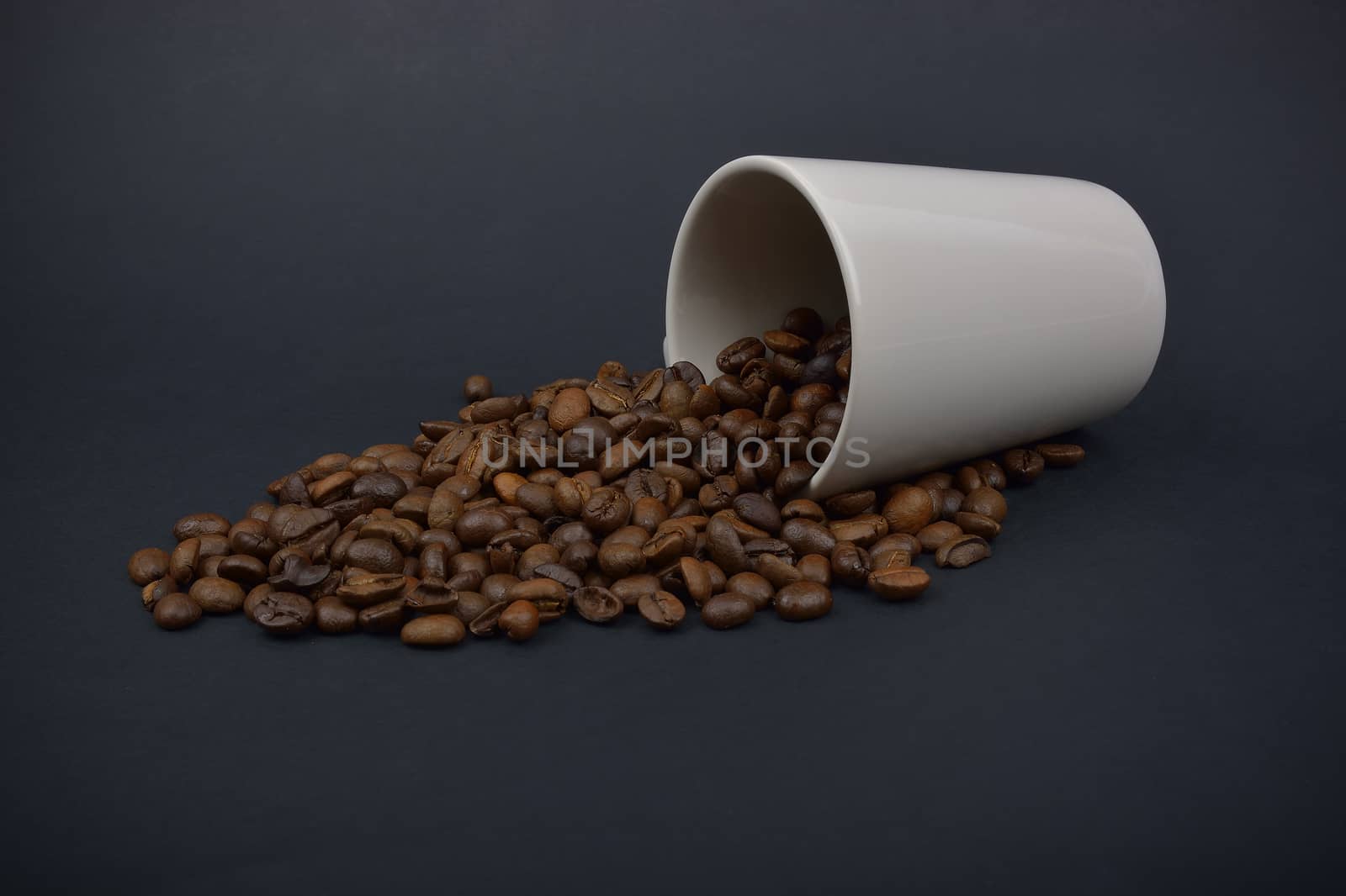 coffee beans stripes and cup in dark background by constantinhurghea