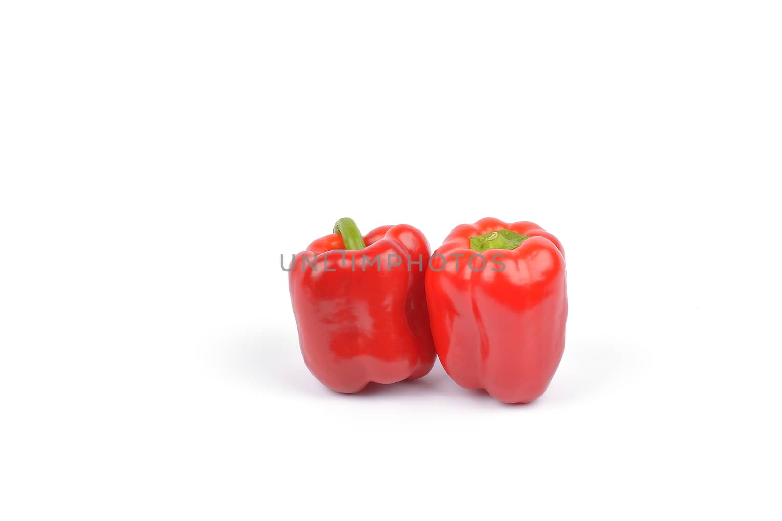 peppers or capsicum on white background by constantinhurghea