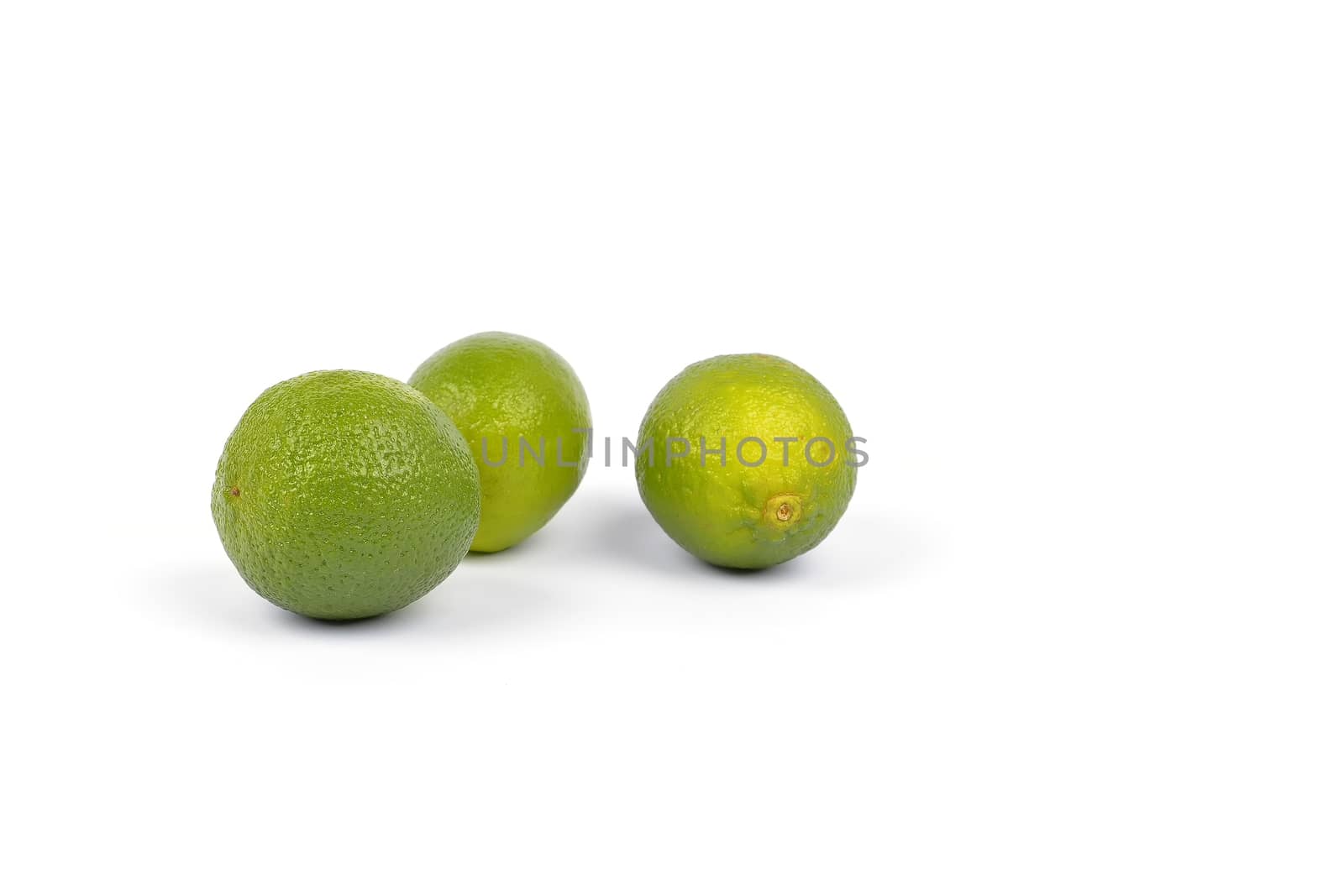 Fresh lime fruit on white background by constantinhurghea