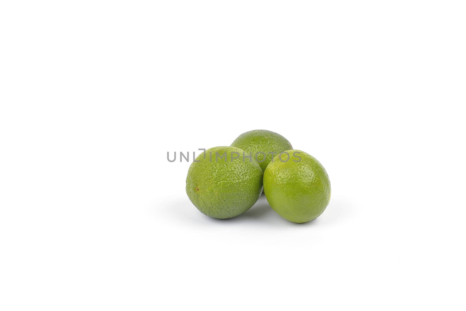 Fresh lime fruit on white background by constantinhurghea