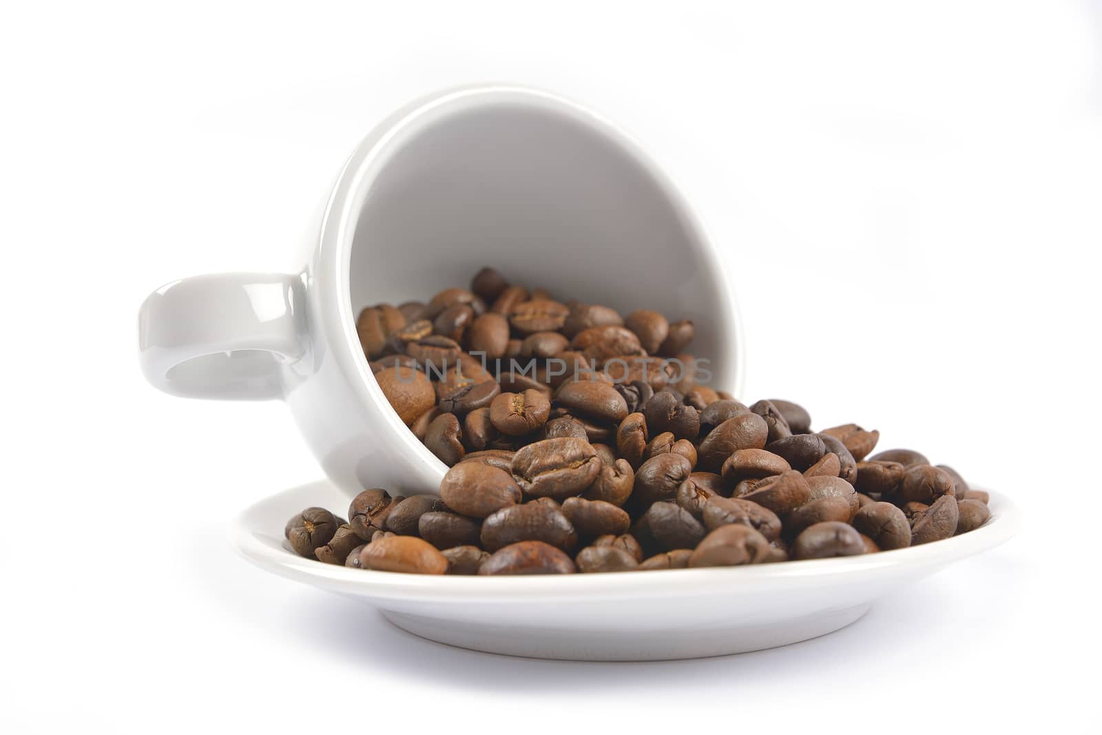 white coffee cup and beans on white background by constantinhurghea