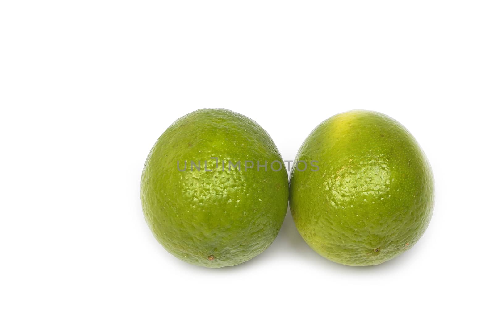 lime fruit isolated on white background by constantinhurghea