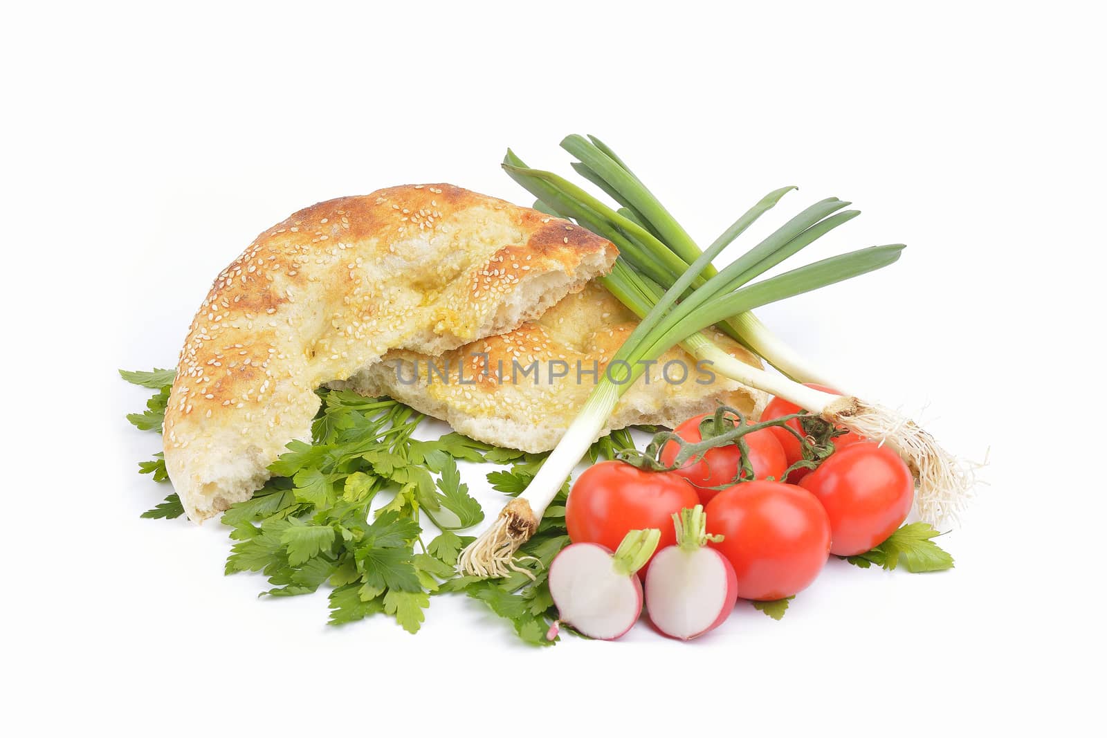 fresh homemade natural bread with vegetables  on white background by constantinhurghea