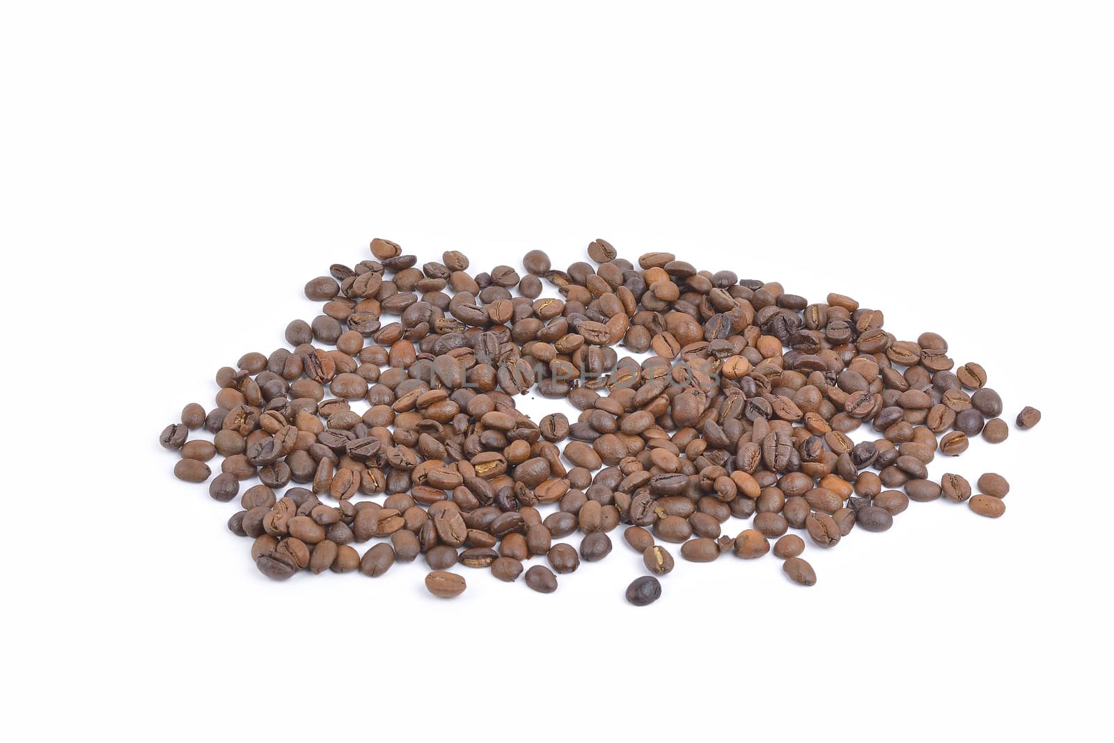 Roasted coffee beans pile from top on white background by constantinhurghea