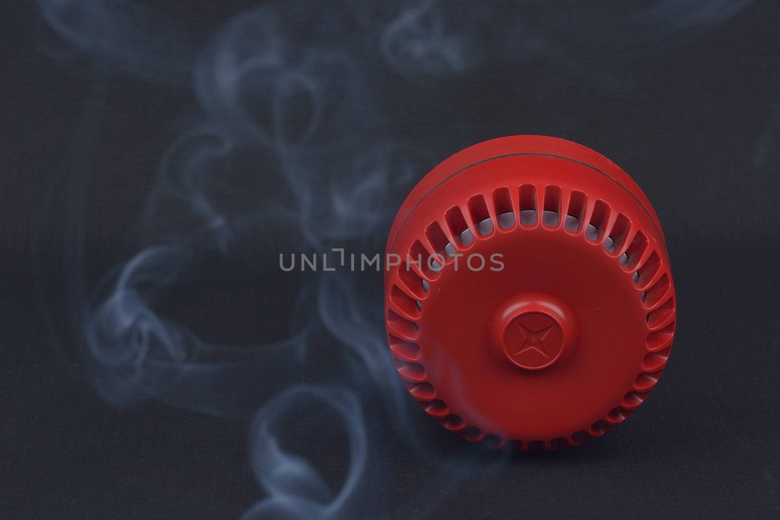 red fire siren with smoke 