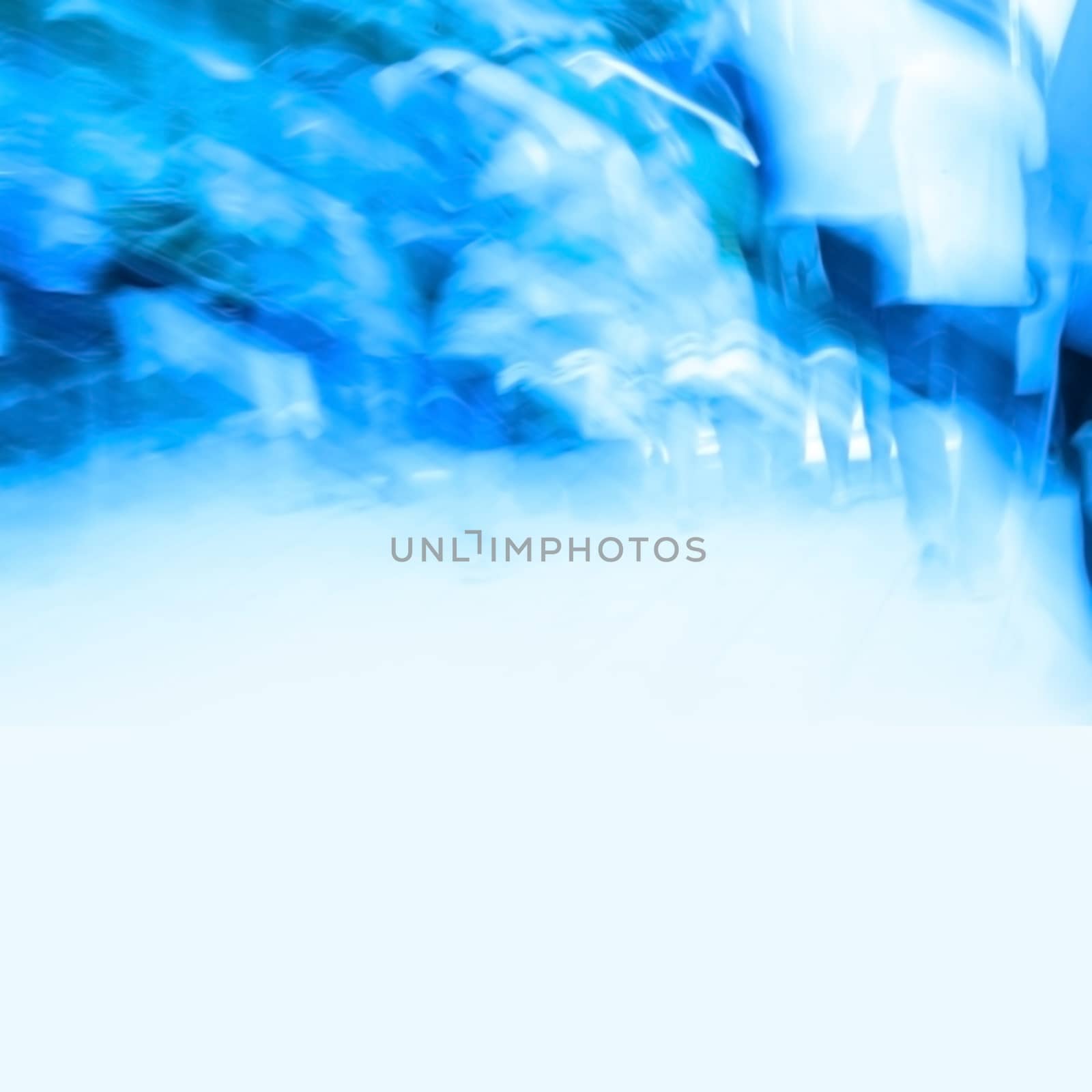 Crowd of people. Blue motion blur abstract picture with free copyspace.