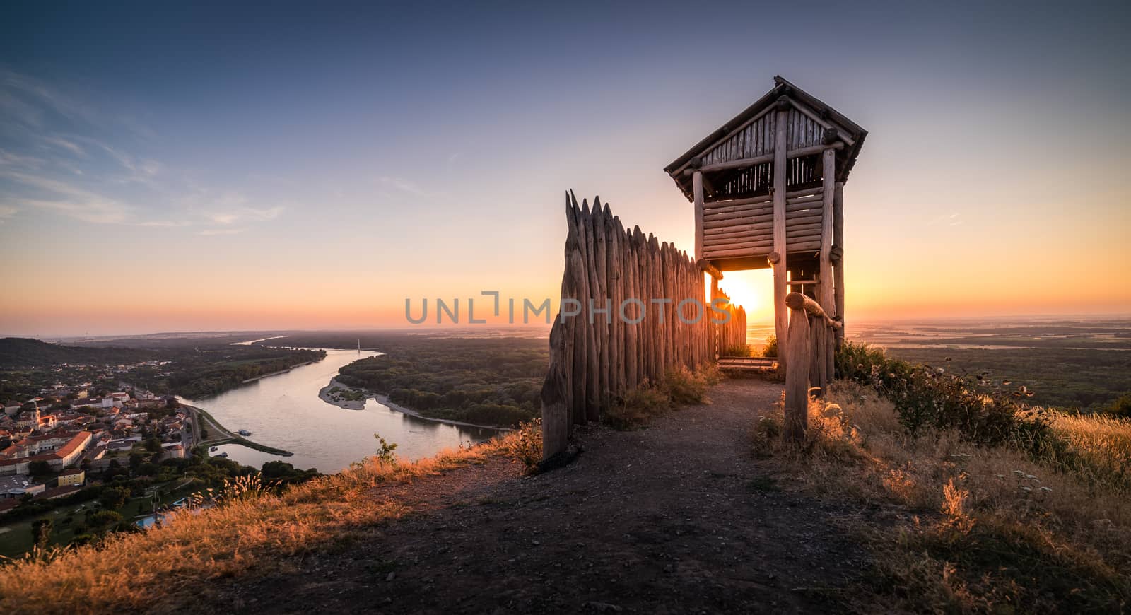 Wooden Tourist Observation Tower above a Little City of Hainburg an der Donau with Danube River at Beautiful Sunset