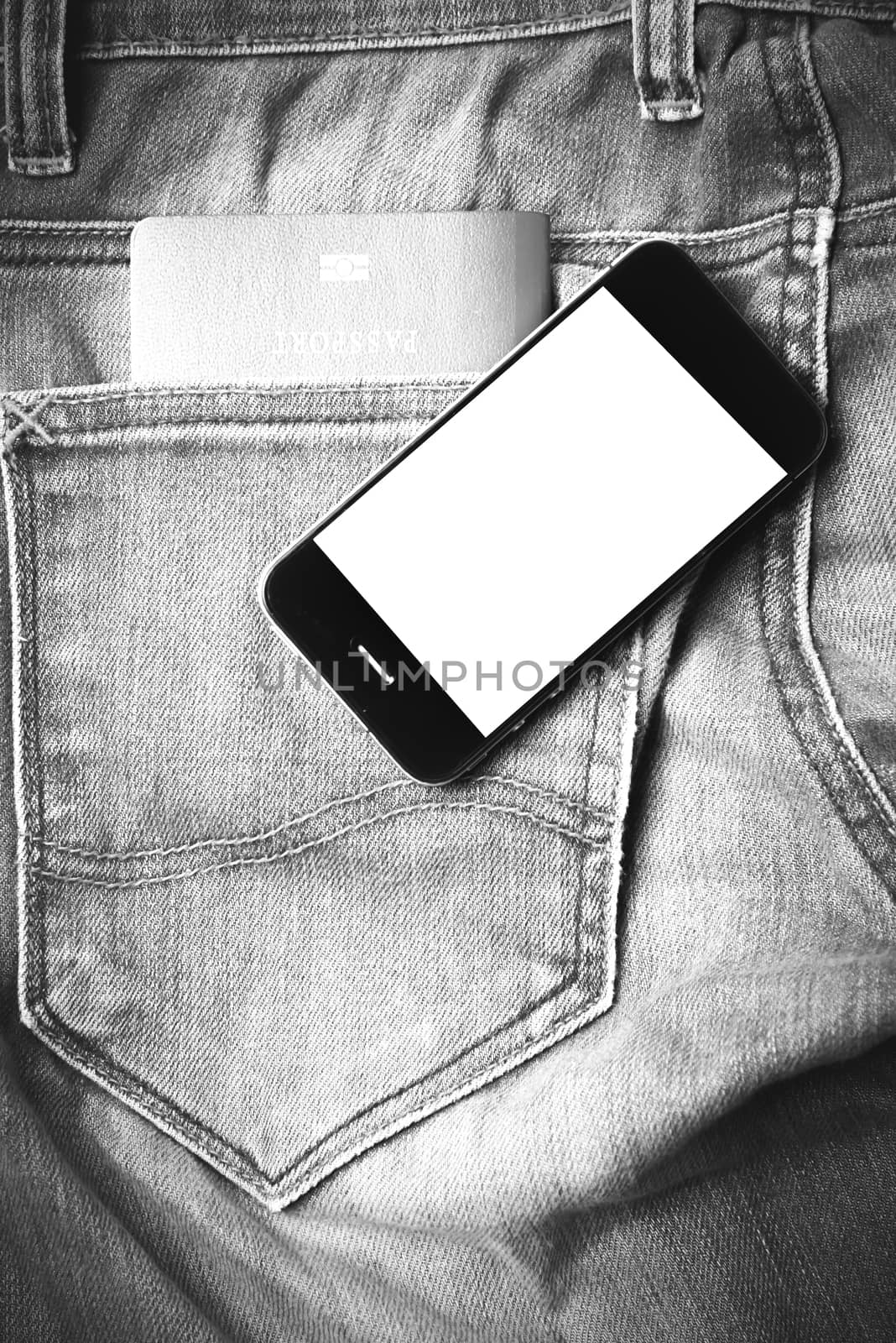 passport in jean pocket with smart phone black and white tone color style