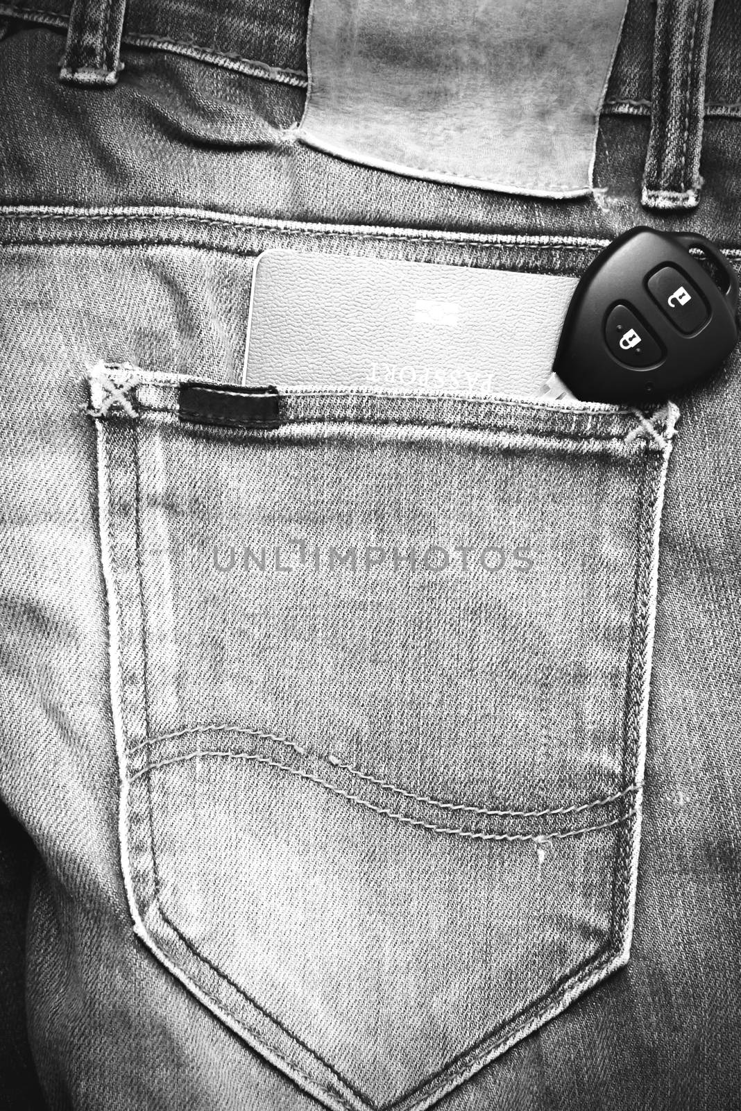 passport in jean pocket with car key black and white tone color style