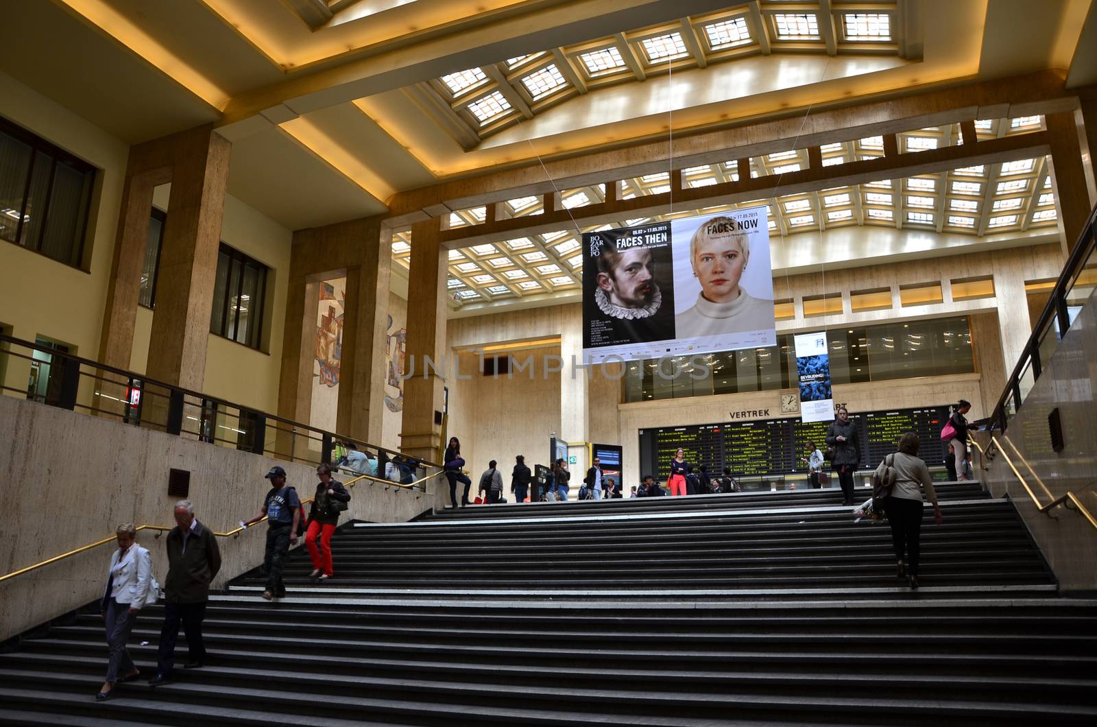 Brussels, Belgium - May 12, 2015: Travellers in the main lobby of Brussels Central Train Station by siraanamwong