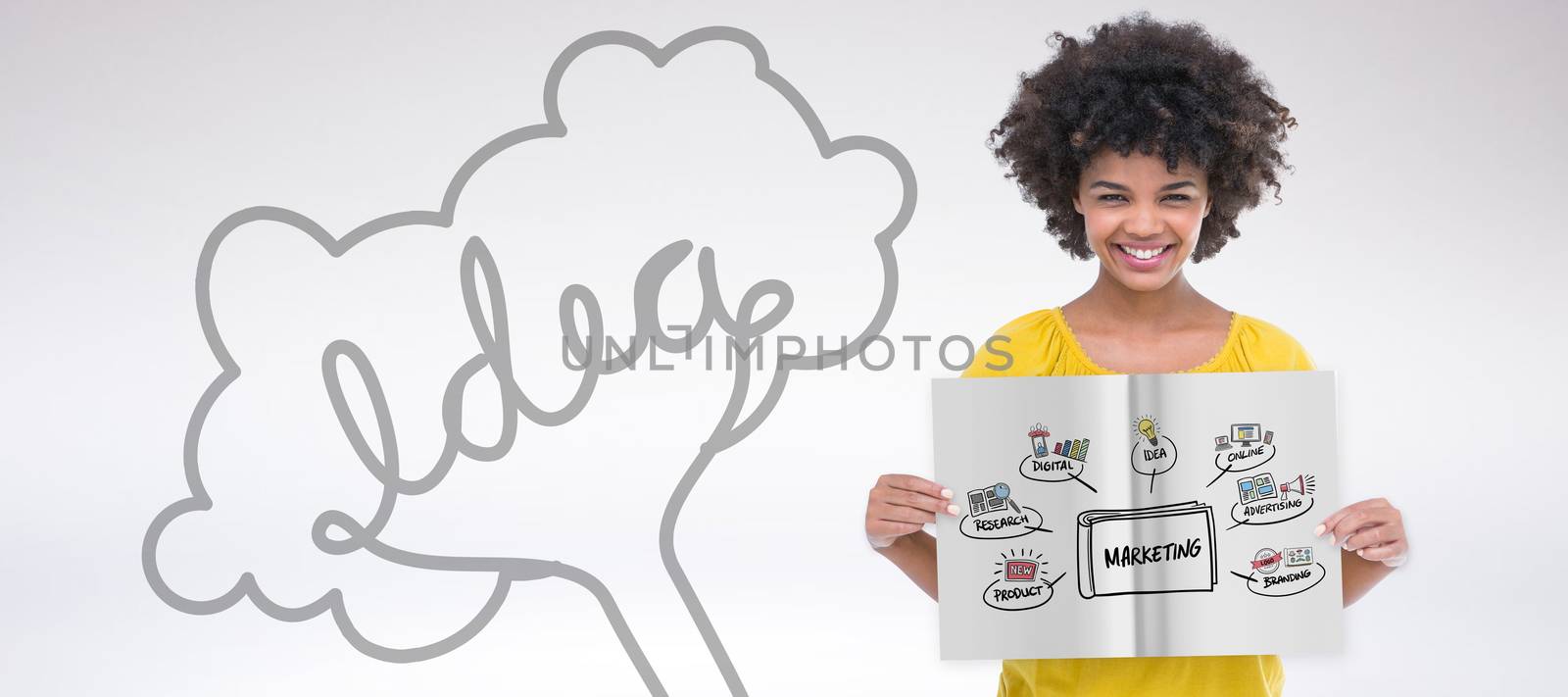 Pretty girl showing a book against grey background