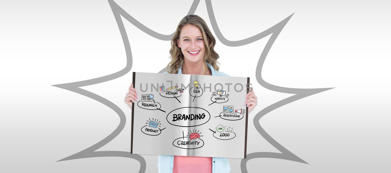 Pretty woman showing a book against grey background