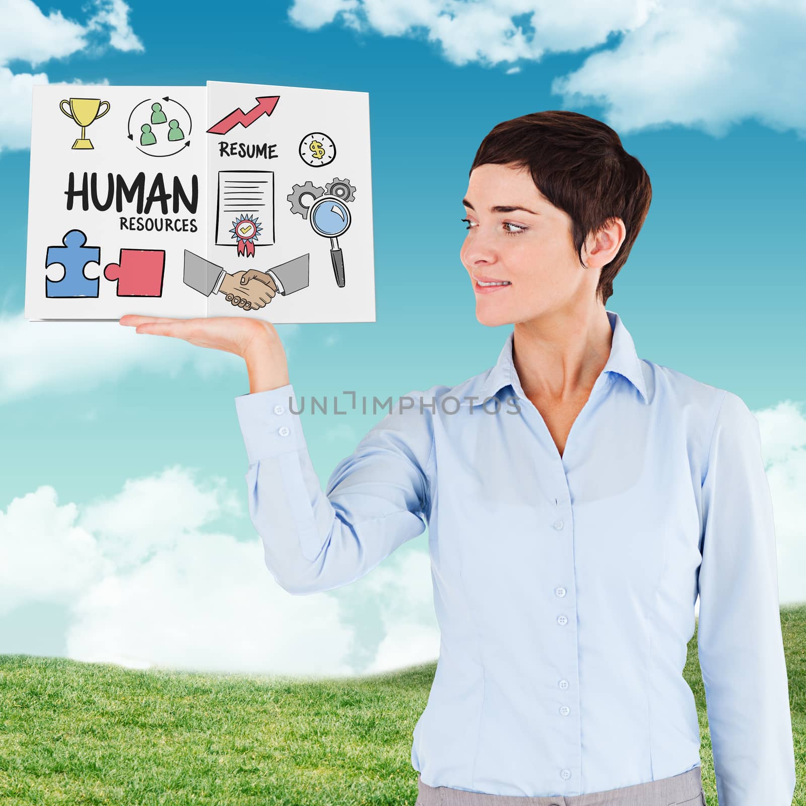 Businesswoman showing a book against blue sky over green field