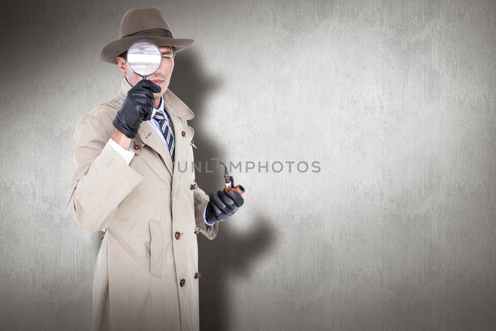 Spy looking through magnifier against white and grey background