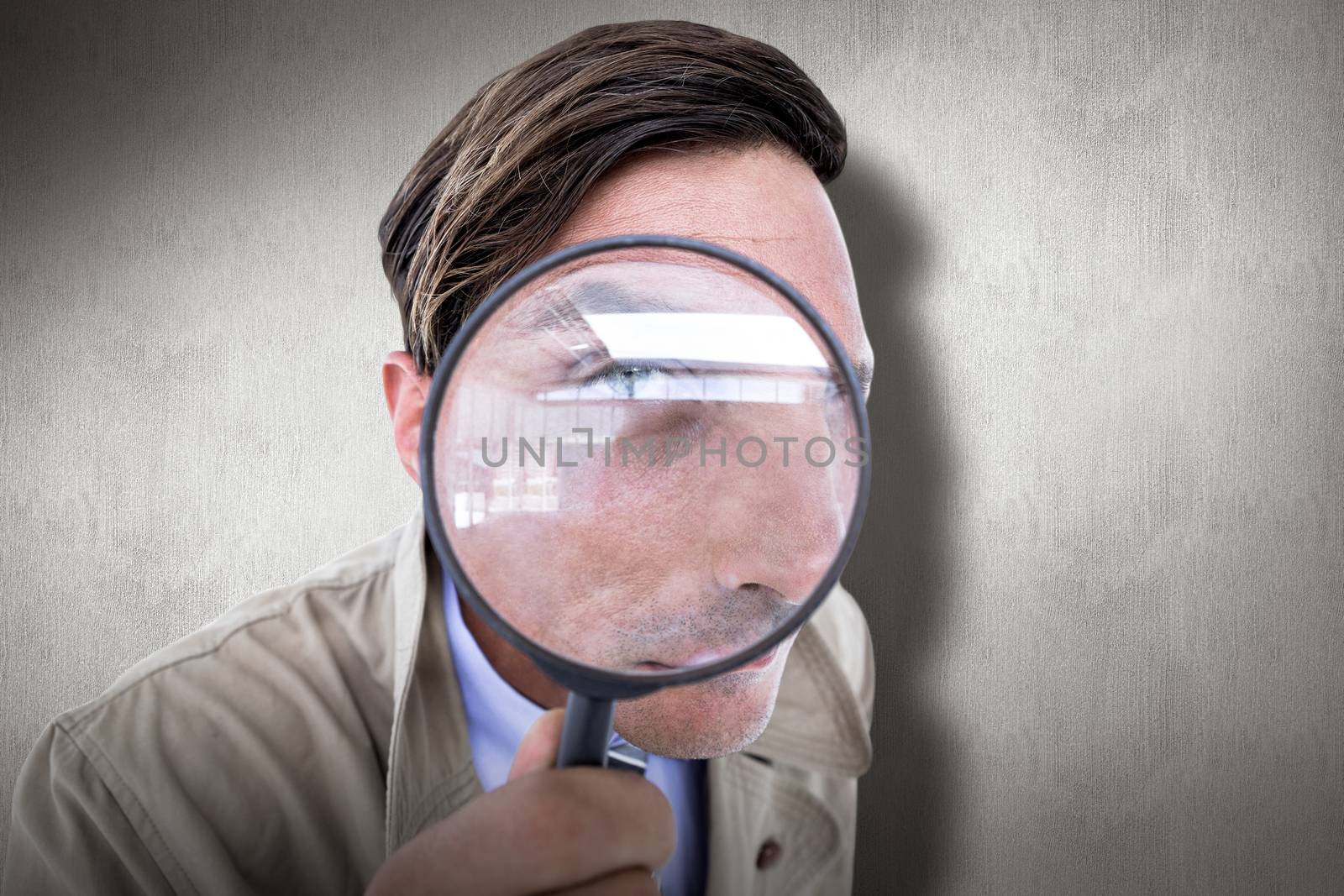 Spy looking through magnifier against white and grey background