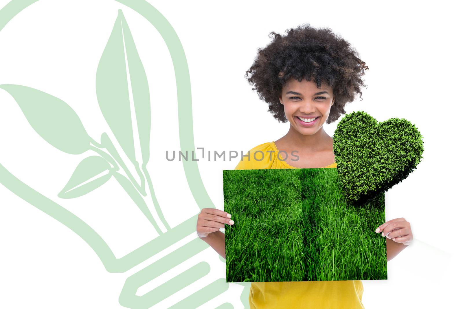 Composite image of woman holding lawn book by Wavebreakmedia