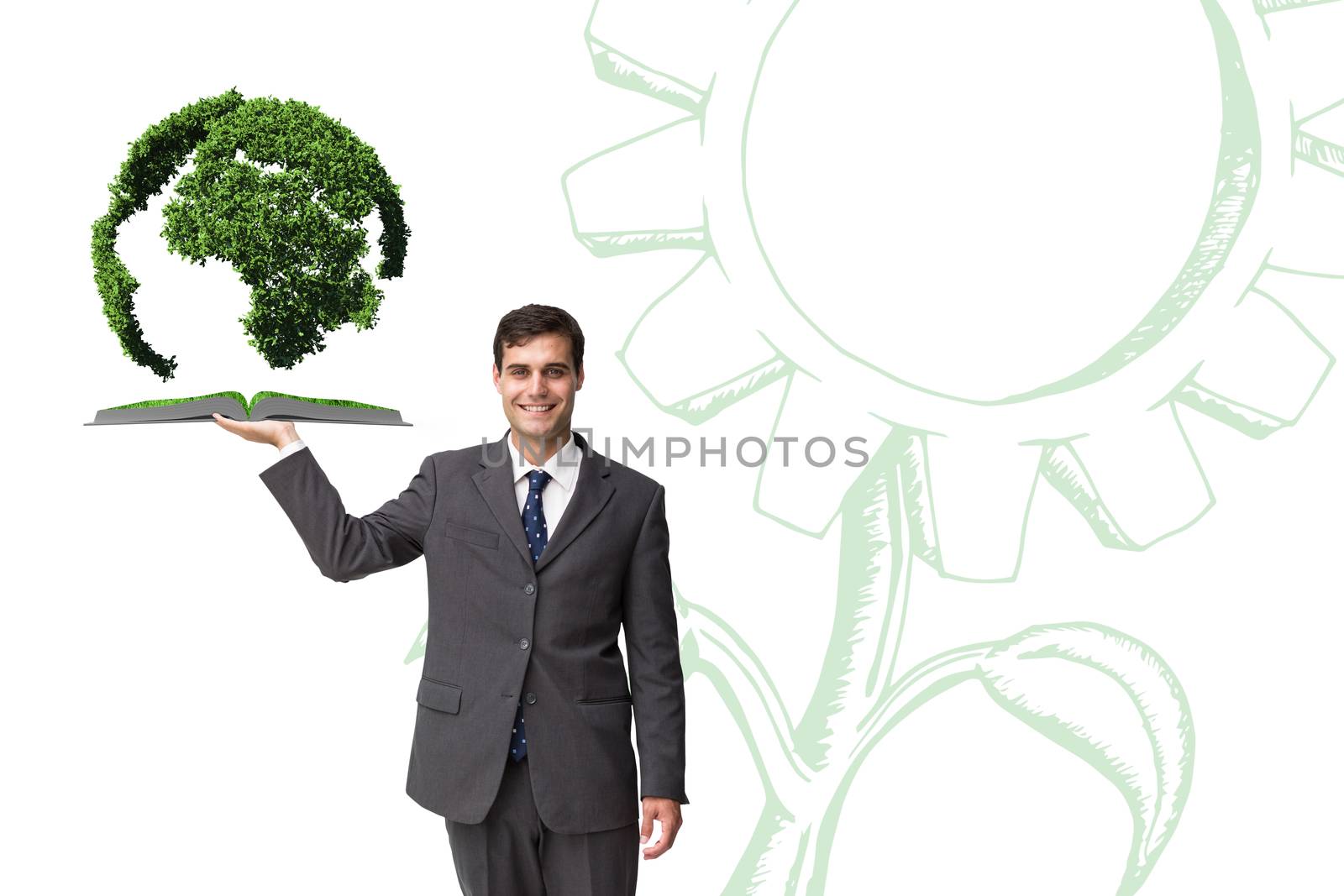 Composite image of man holding up lawn book by Wavebreakmedia