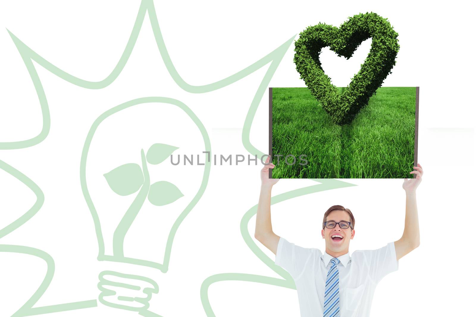 Man holding up lawn book against heart made of leaves