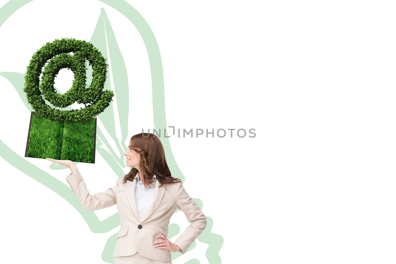 Woman holding lawn book  against at sign made of leaves