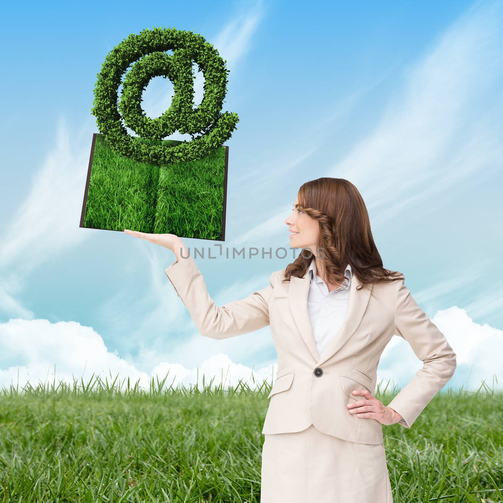 Woman holding lawn book  against blue sky over green field