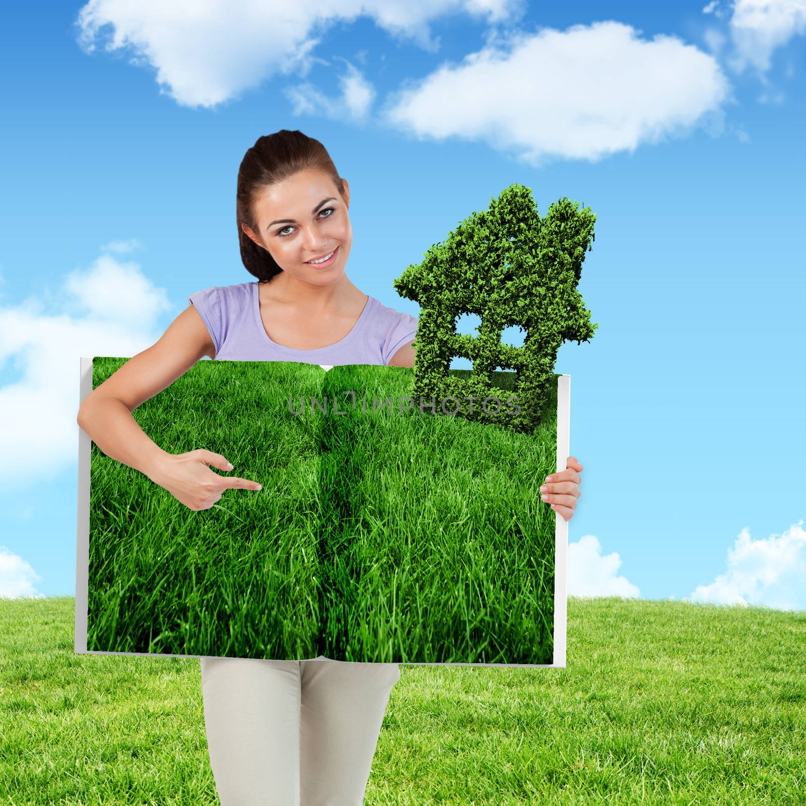 Woman pointing lawn book against blue sky over green field