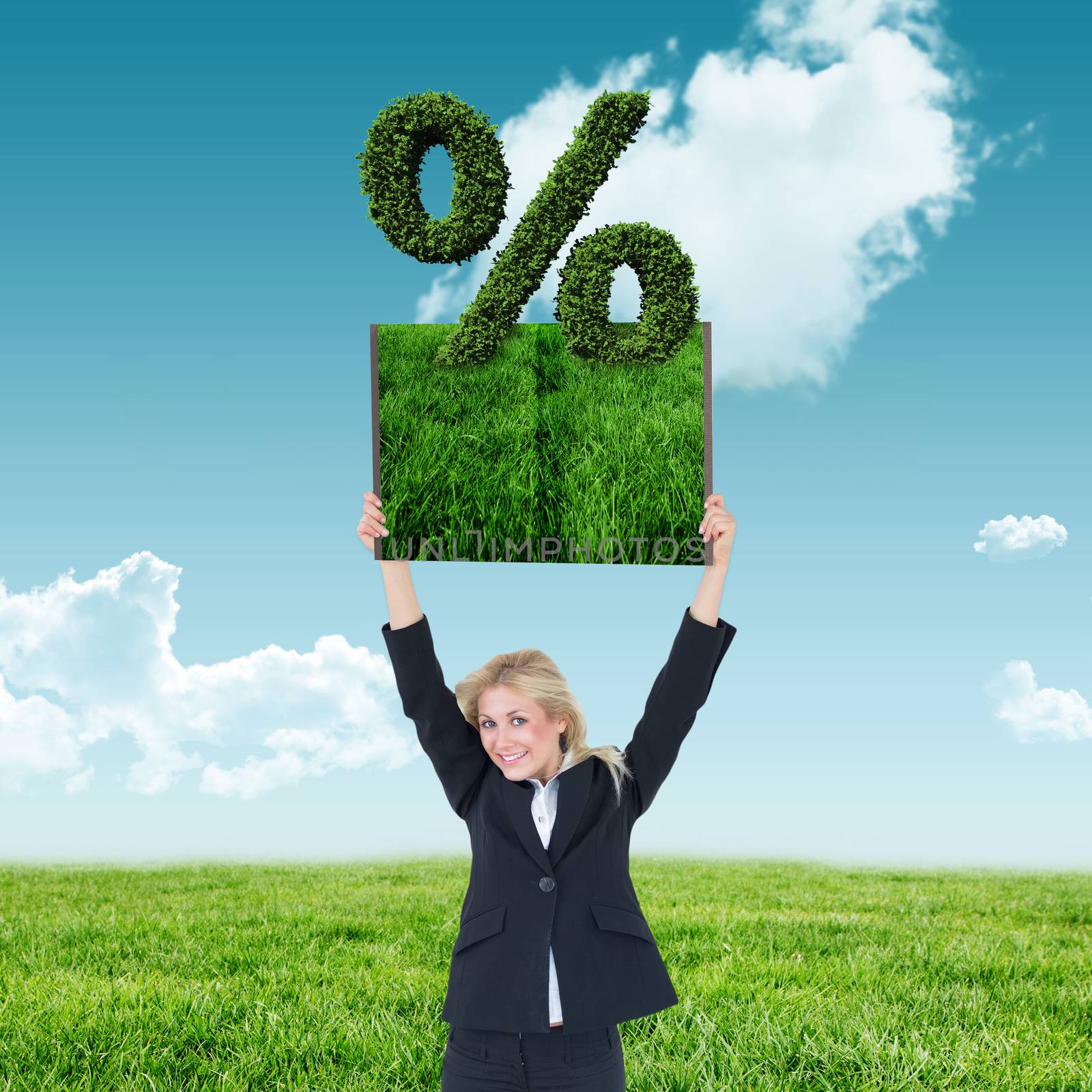 Woman holding up lawn book against blue sky over green field