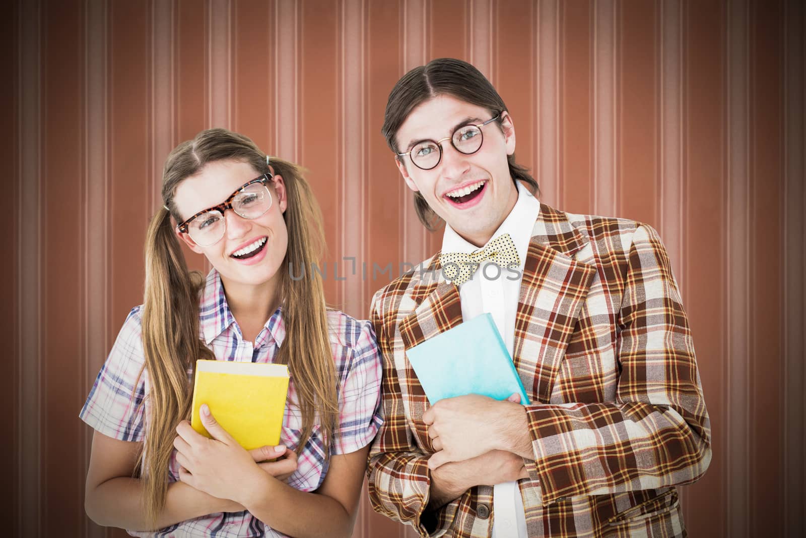 Geeky hipsters smiling at camera  against background