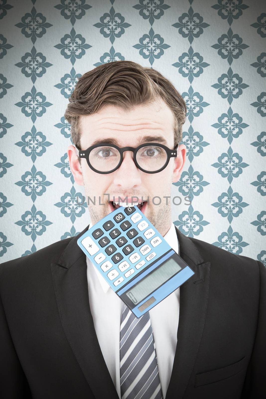 Composite image of geeky businessman biting calculator by Wavebreakmedia
