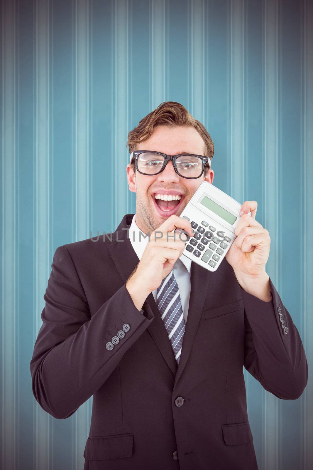 Geeky businessman pointing to calculator  against blue background