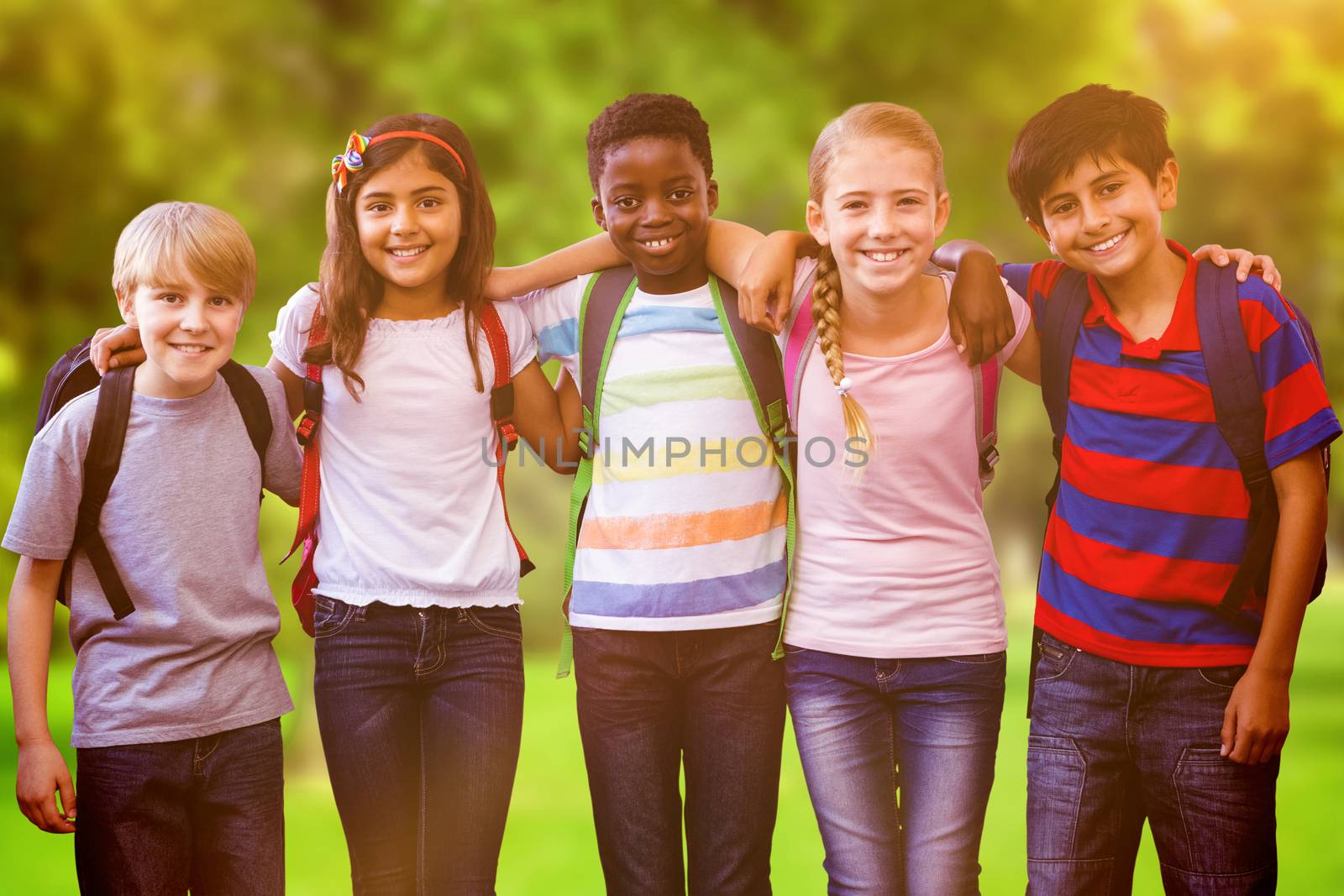 Smiling little school kids in school corridor against trees and meadow