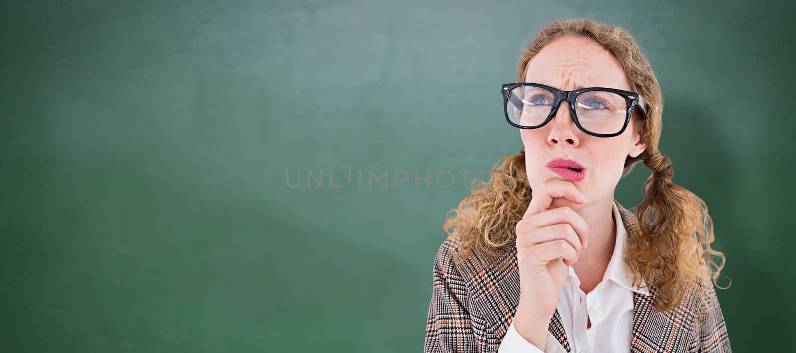 Composite image of geeky hipster woman thinking with hand on chin by Wavebreakmedia