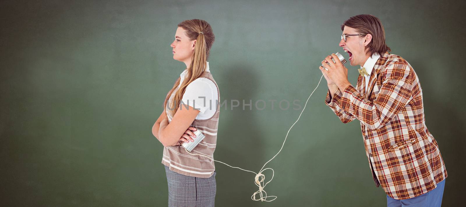 Geeky hipsters using string phone  against green chalkboard